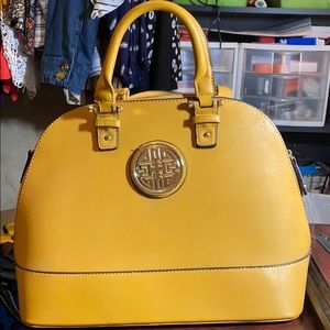 Light brown/tan bowler style purse